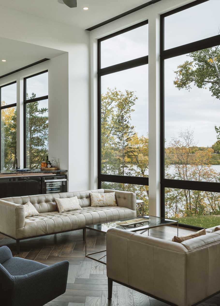 Modern living room interior overlooking a river. 
