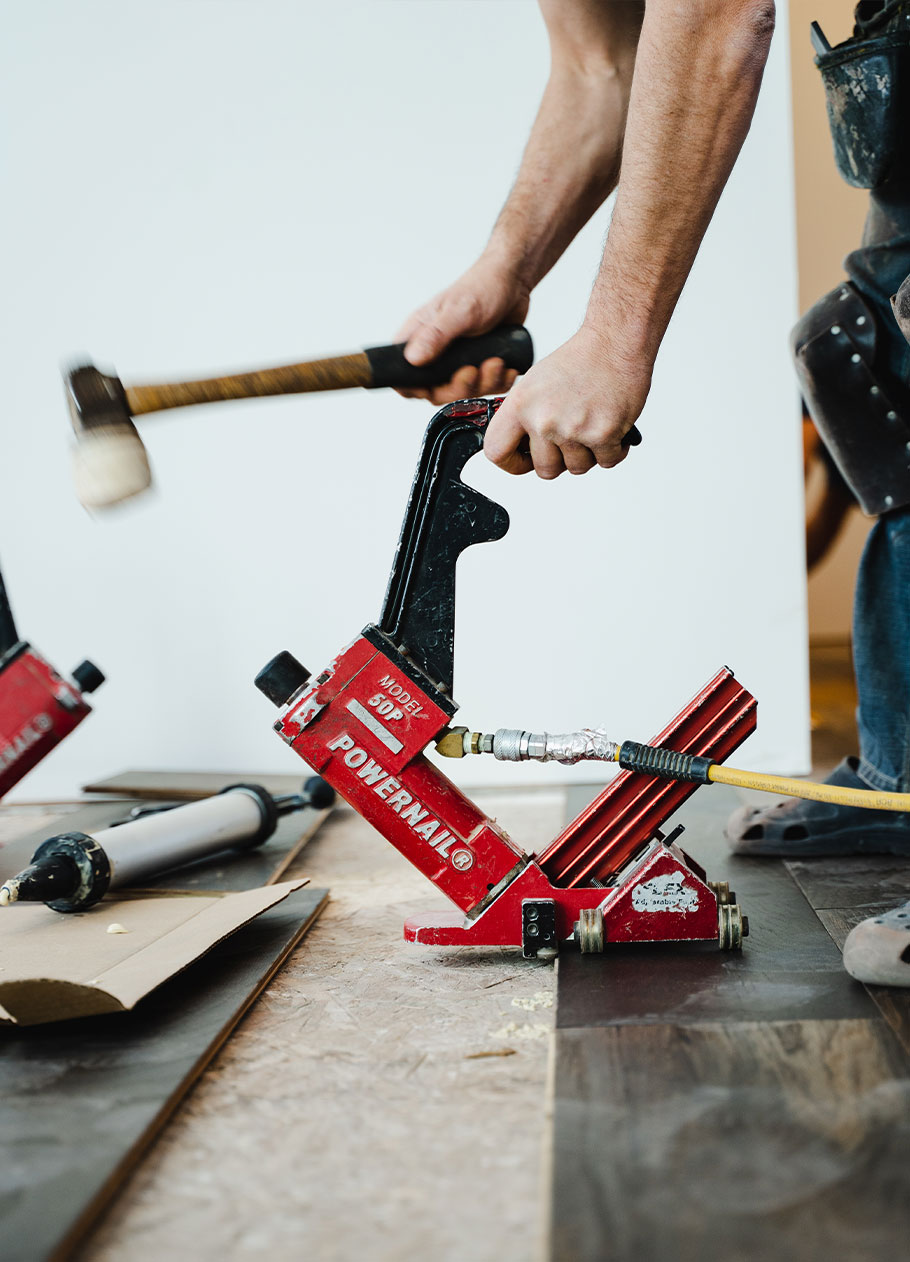Detail of a contractor installing flooring.