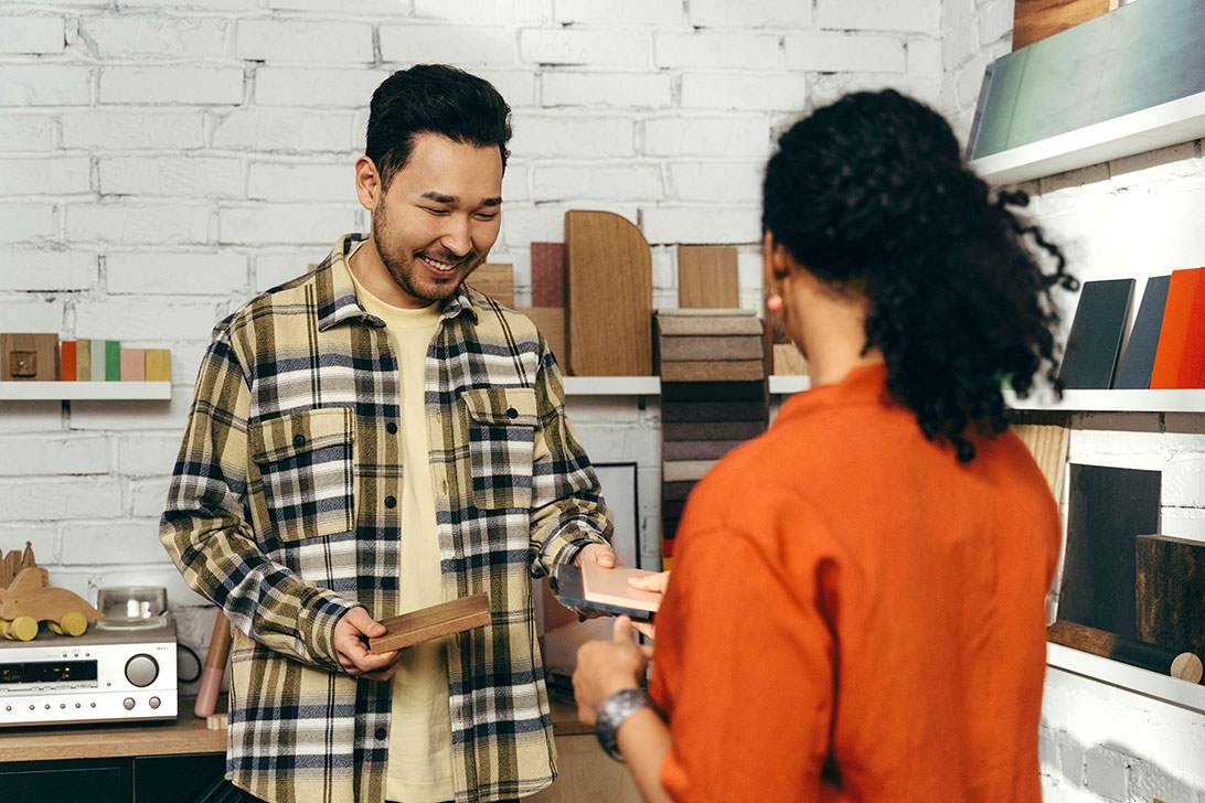 Working with designer selecting finishing materials.